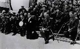General Ion Antonescu, together with Mihai Antonescu (left) and officers, during a religious service. He is wearing the 