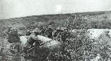 Romanian infantry advancing through marshlands. The soldier up front is carrying a ZB 30 LMG