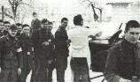 Romanian soldiers from a motorized cavalry recon unit lined up for lunch