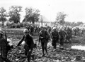 Romanian infantry marching on a mud road